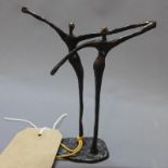 After Alberto Giacometti, a bronze study of two dancers, bears signature, H.16cm