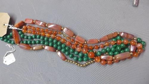 A malachite beaded necklace, together with a gemstone beaded necklace, and another gemstone