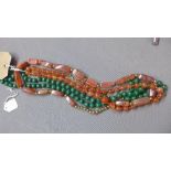 A malachite beaded necklace, together with a gemstone beaded necklace, and another gemstone