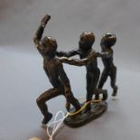A bronze figural study, 'Team Spirit', on oval base, signed, H.15