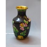 A small Chinese cloisonne enamel vase, polychrome decorated with flowers and butterflies on a