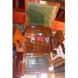 An early 20th century oak stationary box, with rectangular hinged top opening to reveal a fitted