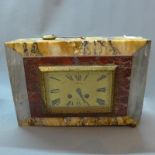 A French Art Deco mable mantel clock, the rectangular dial with Roman numerals, dial signed 'J.
