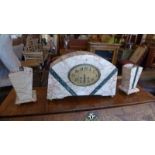 An Art Deco variegated marble mantel clock and matching garniture (a/f), drum movement, the oval