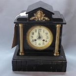A reproduction mantel clock, with Roman enamel dial flanked by pillars, on pedestal base, H.30cm
