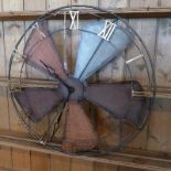 A contemporary wall clock, modelled as a fan, having pierced chapter ring with Roman numerals,