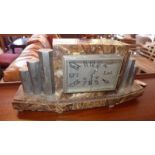 An Art Deco marble mantel clock, eight day drum movement, the rectangular brass dial with Arabic