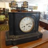 A Victorian black slate and marble mantel clock, the white dial with Roman numerals, drum