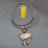 A Cambodian white metal necklace, with dragon head pendant