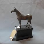 A resin study of a horse, on ebonised pedestal base, H.35cm