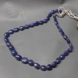 A tanzanite beaded necklace, with white metal clasp stamped 925