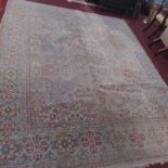 A large early 20th century carpet, with William Morris style spirit design