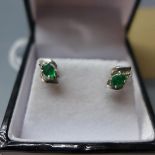 A pair of ladies 14k white gold and emerald earrings, stamped 585 14k