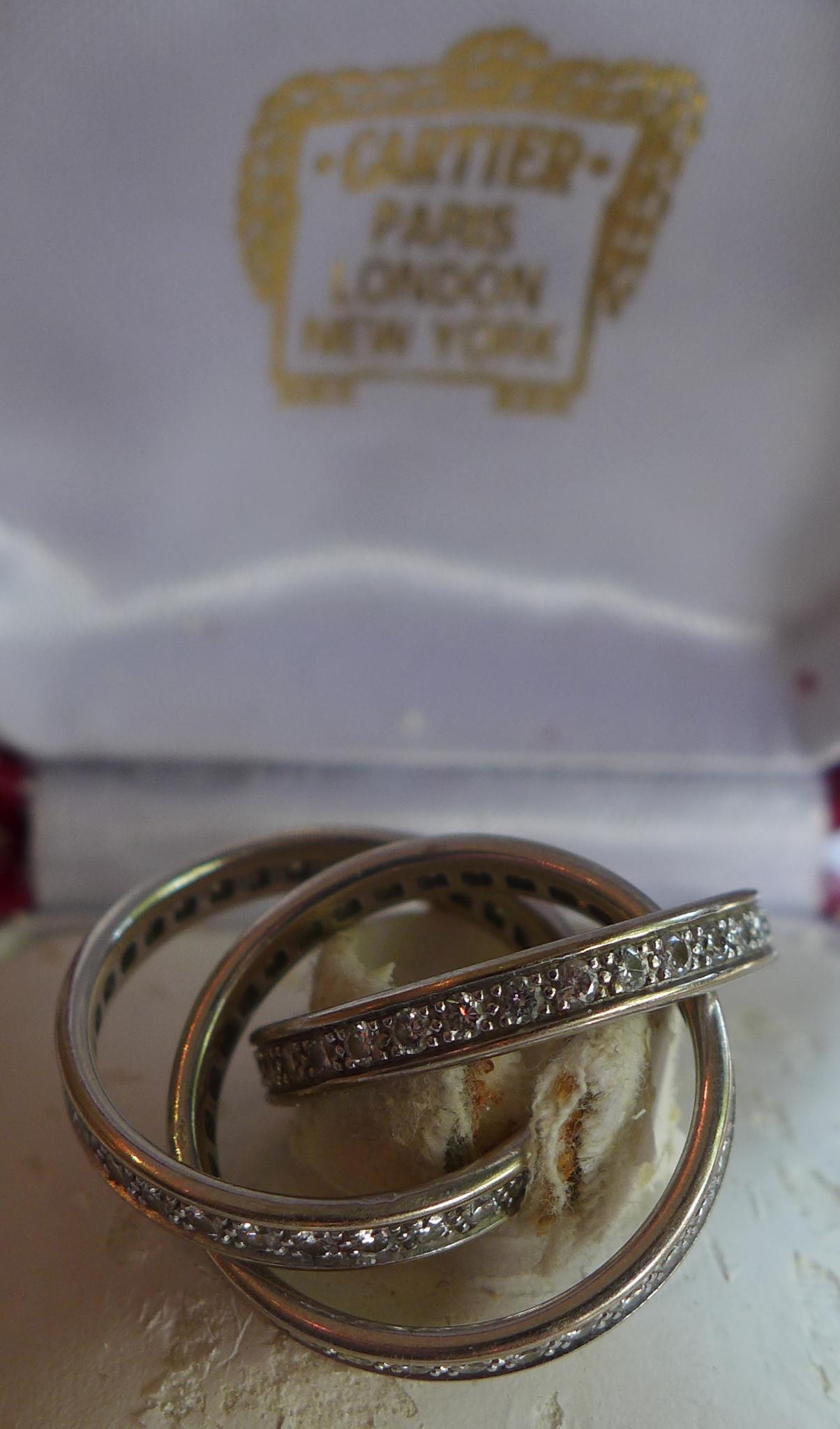 A Cartier 18ct white gold 'Trinity' ring, inset with diamonds, signed Cartier, stamped 750, serial - Image 2 of 2