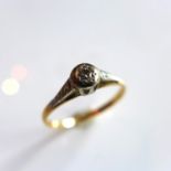 A Ladies yellow gold ring inset with single diamond, marked 18ct Plat, size M