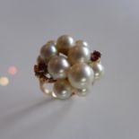 A yellow gold Ladies Pearl and Ruby cluster ring, marked 14k, size R