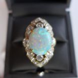 A Ladies yellow metal, probably 18ct gold, ring of Art Deco design having central Opal and