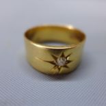 An 18ct yellow gold ring inset with diamond within star design, hallmarked, approx. 8g