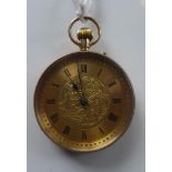 A 9ct yellow gold open face pocket watch, the dial with Roman numerals, engraved scrolling foliate