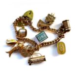 A 9ct yellow gold charm bracelet, with 9ct yellow gold and yellow metal charms