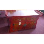 A contemporary Chinese red lacquered altar cabinet, with two drawers and two cupboard doors, H.73