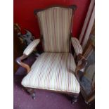 A William IV rosewood armchair, recently upholstered, raised on cabriole legs and castors