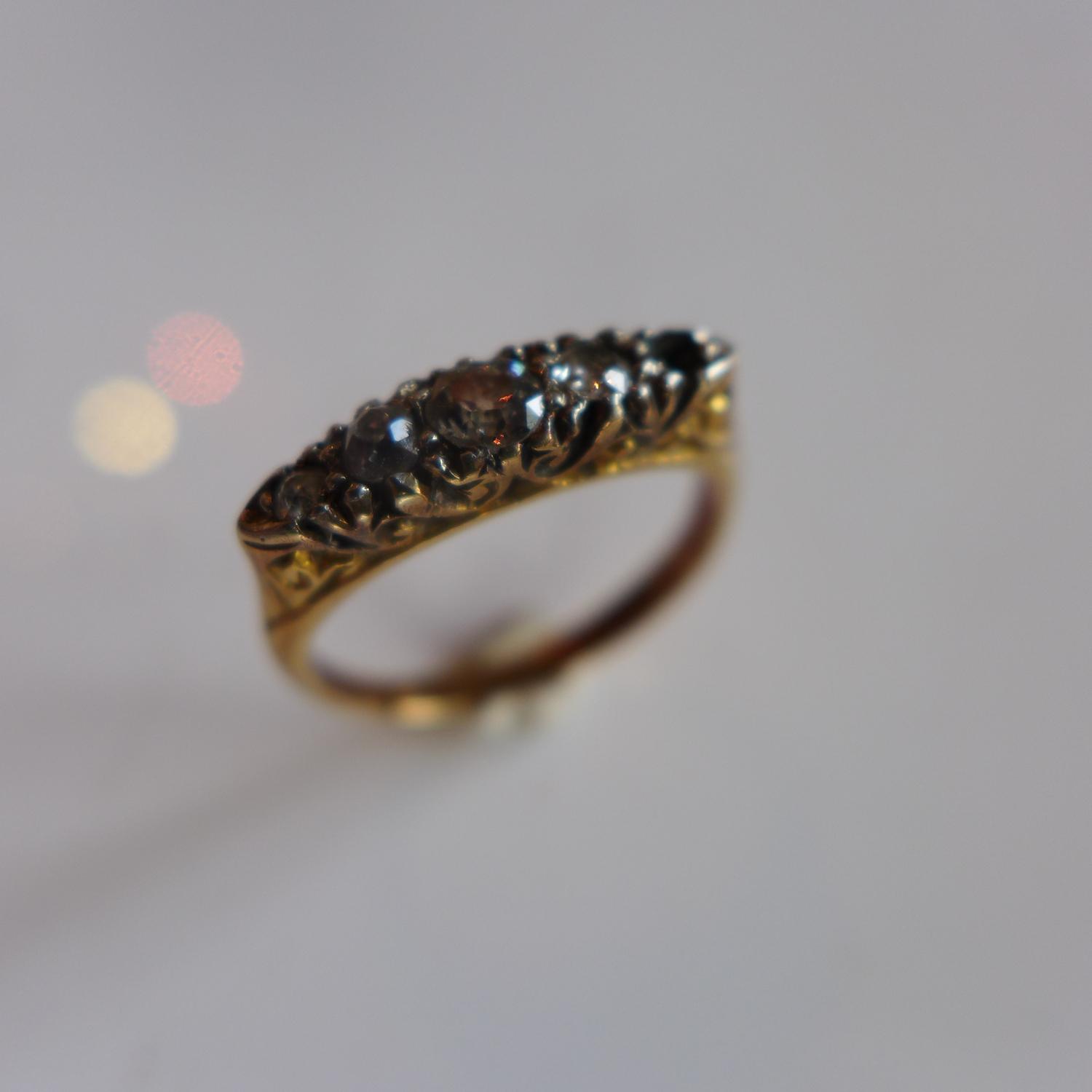 A ladies yellow metal ring, inset with four round cut diamonds (one missing), size J 1/2 - Image 2 of 4