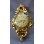 A 20th century Swedish gilt cartel clock, convex dial with Arabic numerals, with floral and C-scroll