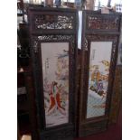 A pair of Chinese pierced hardwood wall plaques, inset with porcelain panels, 120 x 37cm