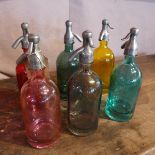A set of six multi coloured glass soda syphons