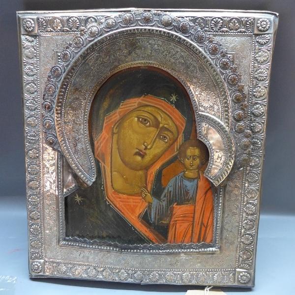 A Russian icon depicting the Mother of God of Kazan, with white metal oklad with floral