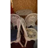 A white painted cast aluminium garden table and four chairs