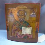 A Russian icon, St Nicholas of Myra, shown frontal, half-length, blessing and holding a Gospel book,