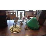 A Christopher Wray brass ceiling light, with three green glass pendants