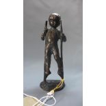 A mid 20th century Continental cast bronze of a boy on stilts, 'Play Time', on oval base, H.16.5cm