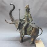 A 20th century bronze study of a god on an elephant, H.30cm