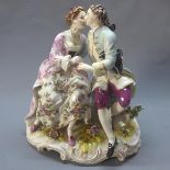 A Meissen style porcelain figural group of a couple kissing, H.24cm