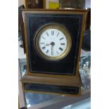 A 19th century French painted oak mantel clock, the Roman enamel dial indistinctly signed, twin-
