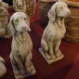 A pair of reconstituted stone sitting dogs, on rectangular bases, H.69cm (2)