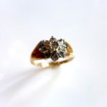 A Ladies 9ct yellow gold ring having flower design inset with diamonds, size P