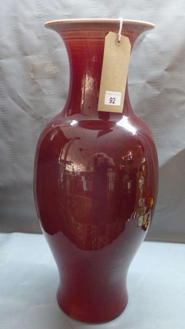 A large 19th century Chinese sang de boeuf vase, with wax seal to base, rim has been repaired, H.