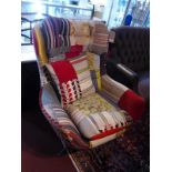 A 'Squint' Contemporary egg chair, with patchwork upholstery, raised on chrome base