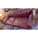 A contemporary brown leather three seater sofa