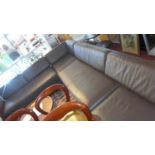 A large Habitat dark brown leather corner sofa