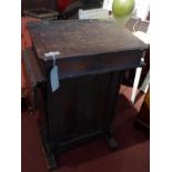 An early 20th century oak lectern, with hinge lid and ink wells