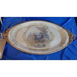 A Sevres porcelain oval dish, hand painted and signed 'Regina Rubin', having gilt metal mounts, in