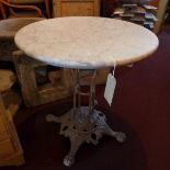 A Coalbrooke style grey painted cast iron table, with marble top, raised on paw feet, H.77