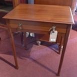 An early 20th century walnut side table, with single drawer, raised on tapered legs and spade