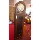 An early 20th century oak longcase clock, raised on bun feet, H.119cm