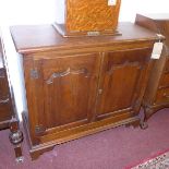 A 20th century oak side cabinet